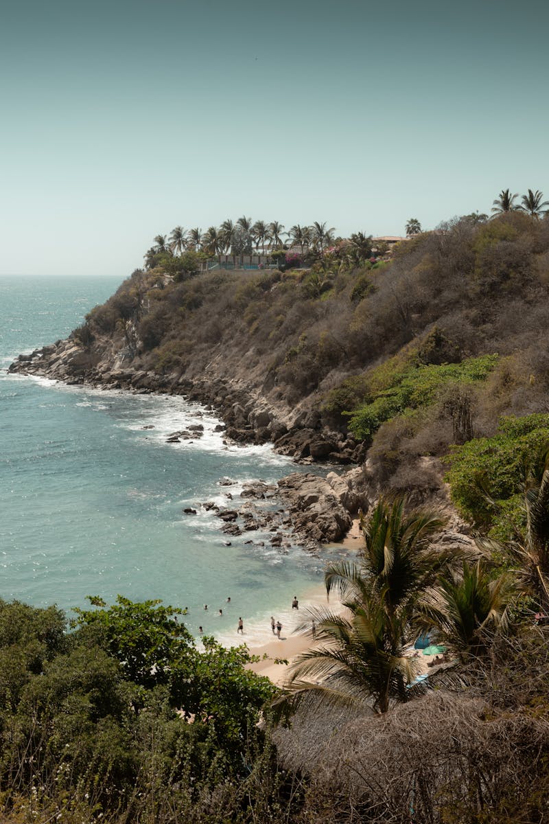 Explore the stunning coastal beauty of Puerto Escondido's rocky beach cove in Mexico.