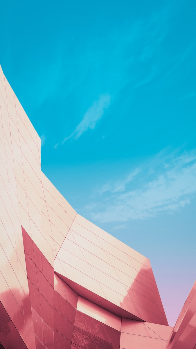 white concrete building under blue sky during daytime