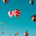 assorted hot air balloons flying at high altitude during daytime